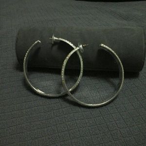 BEBÉ BEDAZZLED RHINESTONE HOOP EARINGS.